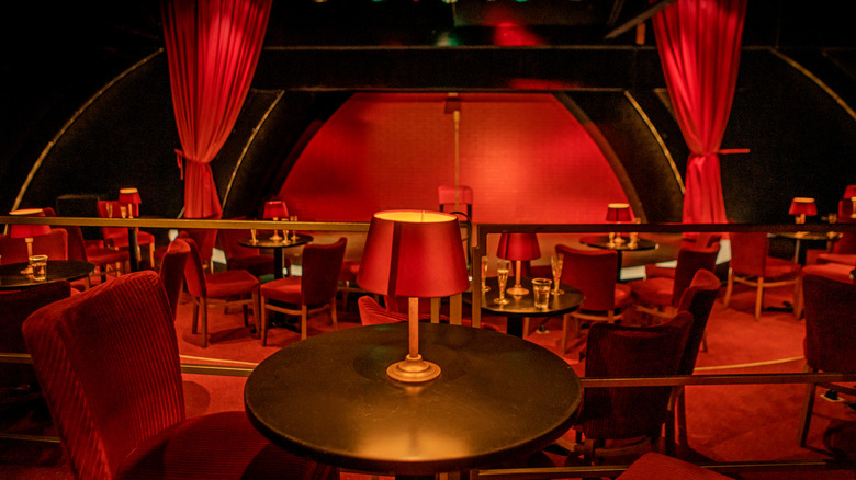 Empty tables at a cabaret-style club
