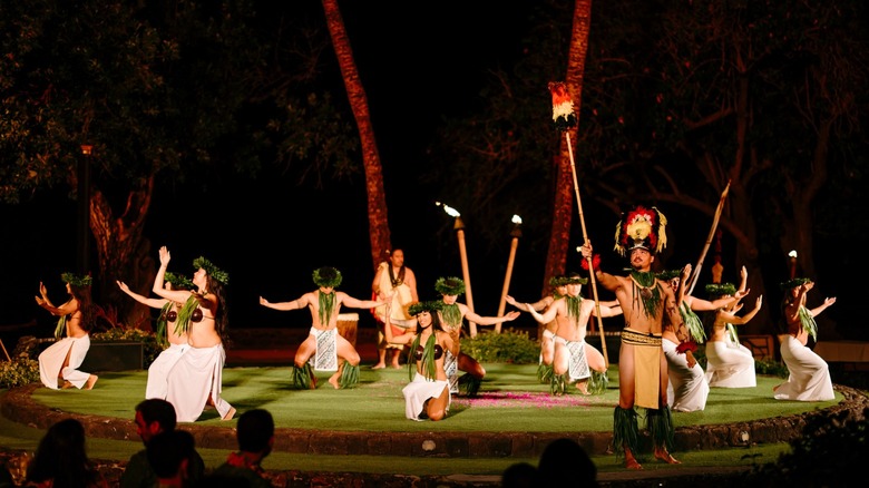 Dancers at a night performance of a luau