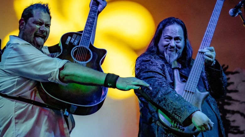 Two guys on stage with guitars