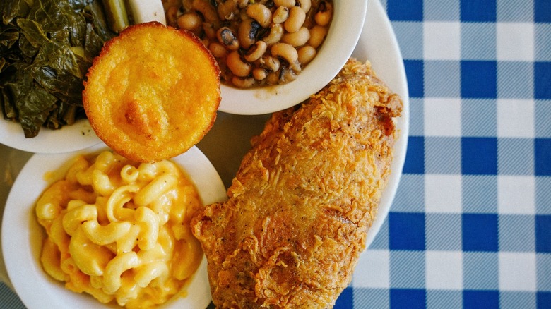 Deep-fried turkey wing with cornbread and sides