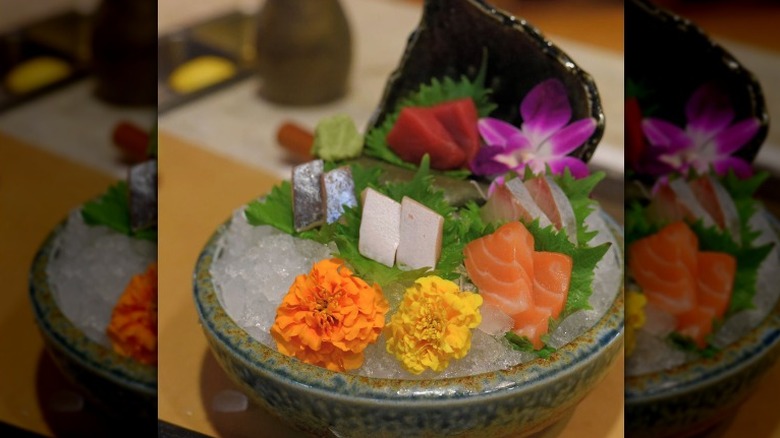 Premium sashimi with floral garnish