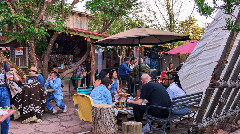 Residents and visitors hang out at Planet Marfa
