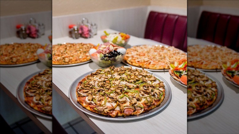 Three different pizza pie flavors from The Pizza House