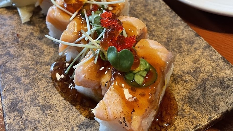 Salmon sushi with red caviar on top