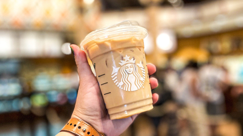 Holding a dirty chai latte