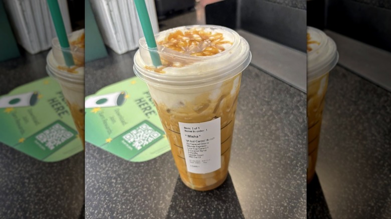 Upside down iced caramel macchiato on counter