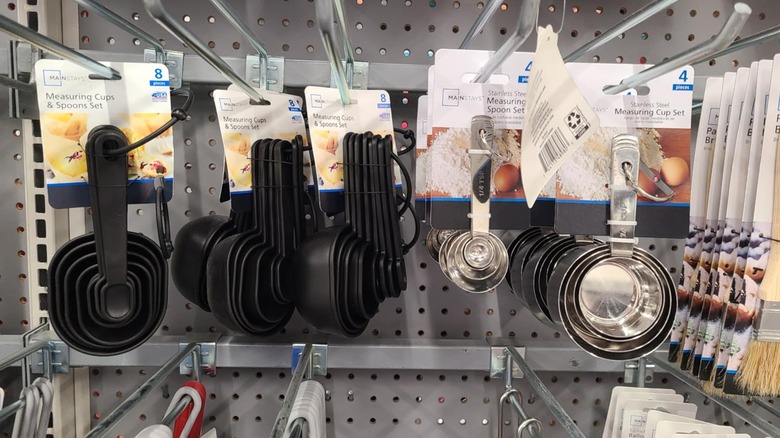 Plastic and metal measuring cups and spoons.