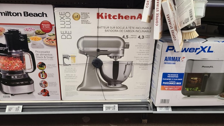 Silver KitchenAid stand mixer in box.