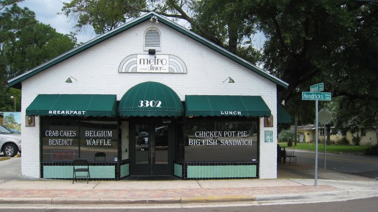 The exterior of Metro Diner restaurant with signs