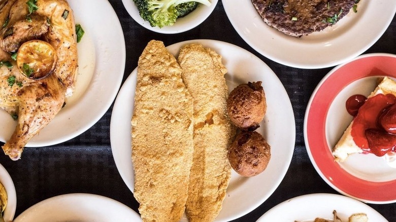 Top view of a comfort meal served at Piccadilly Cafeteria with fried fish and pie
