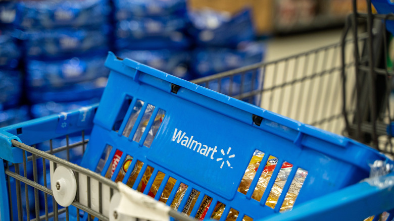 Close up of blue Walmart shopping basket inside cart.