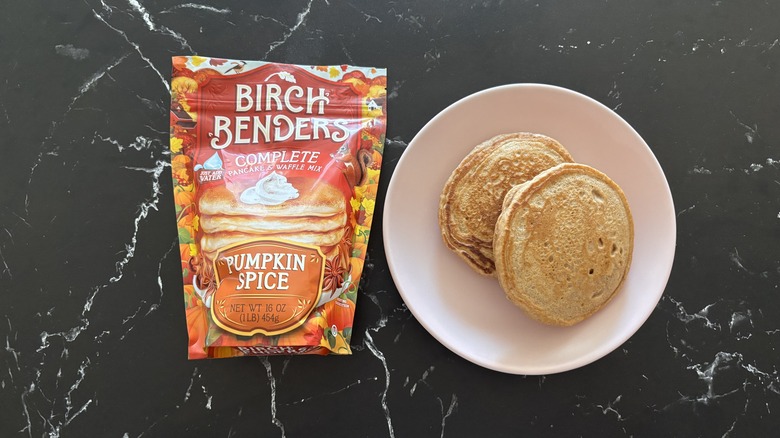 Birch Benders pumpkin spice pancake and waffle mix next to plate with pancakes