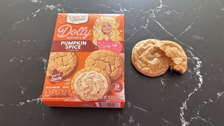 Dolly Parton pumpkin spice cookie mix box next to cookies on countertop