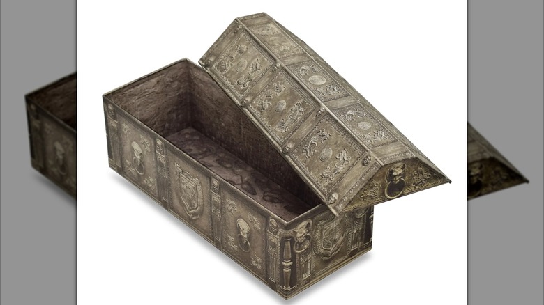 The Nosferatu tomb popcorn bucket sits with the lid propped open