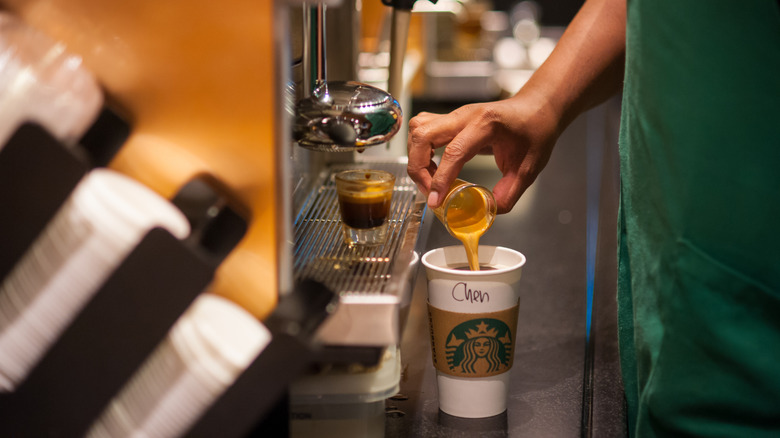 Starbucks barista making an Americano