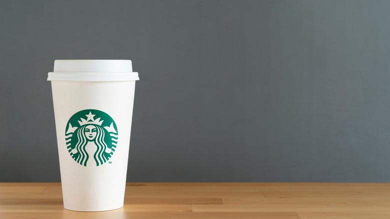 White Starbucks cup with lid