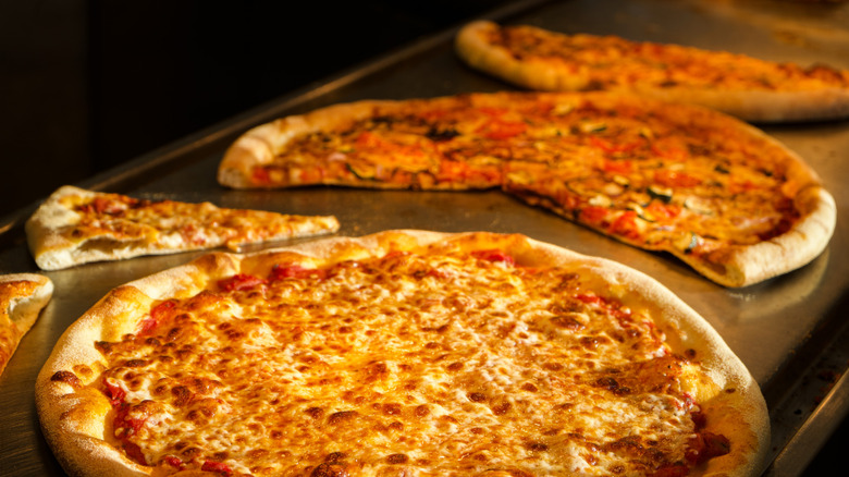 Pizzas on a buffet line