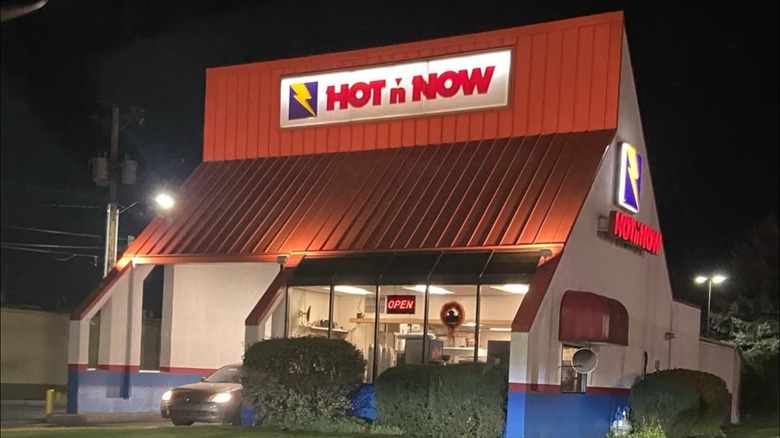Hot 'n Now drive-thru burger restaurant at night