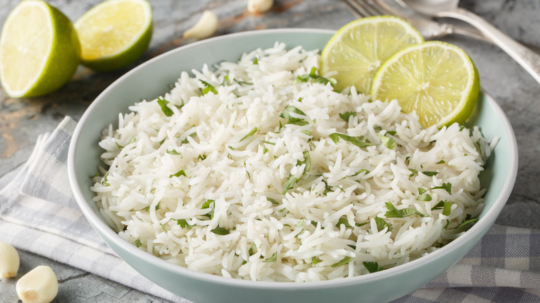 A bowl of cilantro lime rice with lime slices