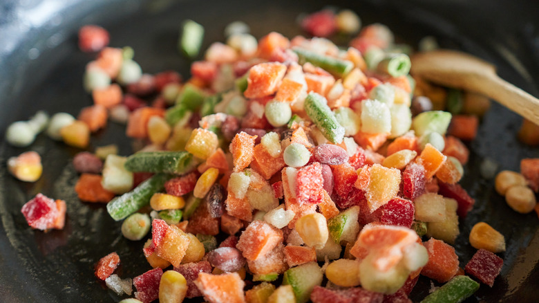 Cooking frozen vegetables over cast iron skillet