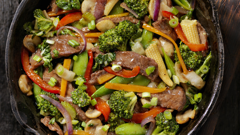 Vegetables stir-fry in cast iron pot