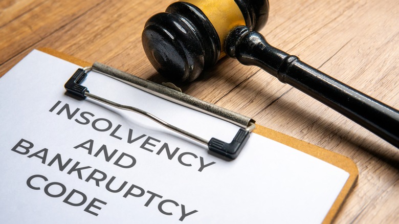 Gavel and paper stating insolvency and bankruptcy code