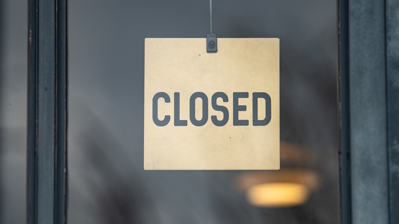 A closed sign in a window