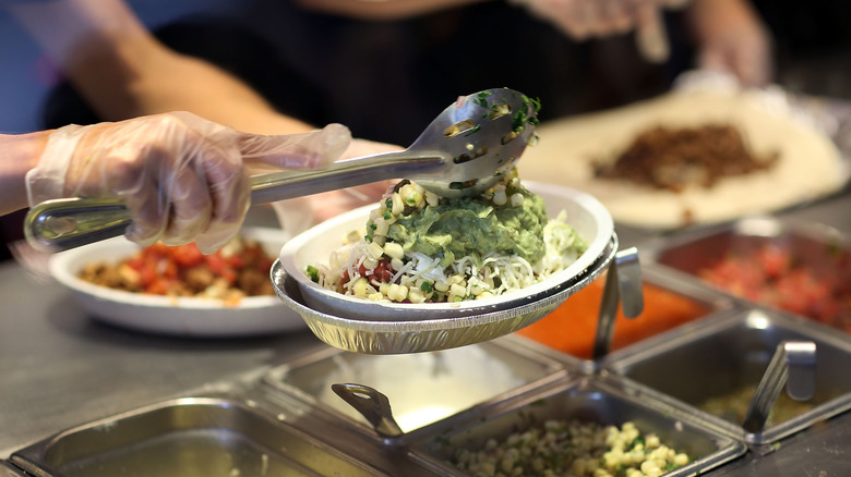Server making food at Chipotle