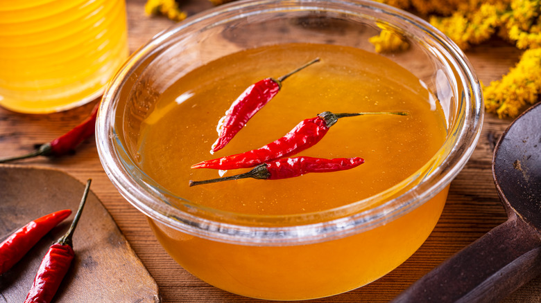 Chile peppers floating in honey