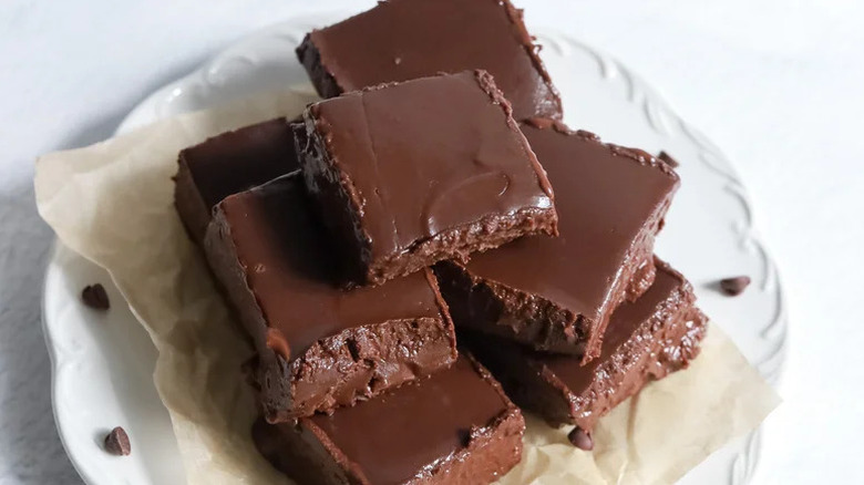 Fudge stacked on white plate