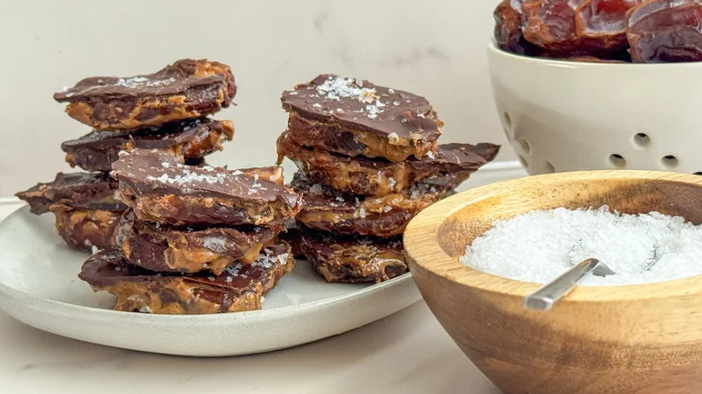 Stacked date bark on white plate