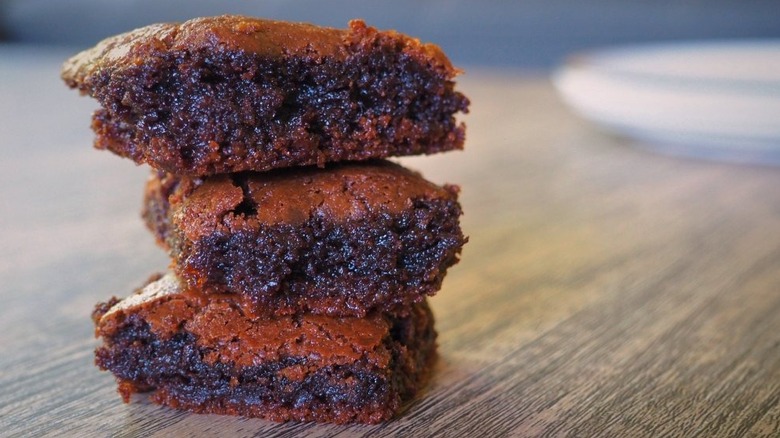 Nutella brownies stacked on wooden table