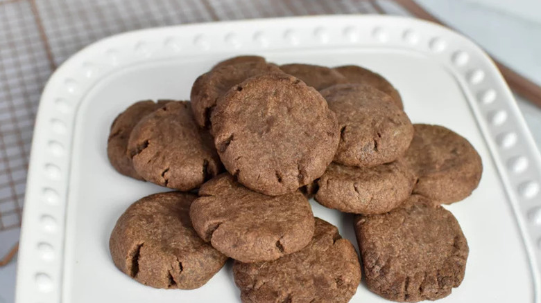 Nutella cookies stacked on white plate
