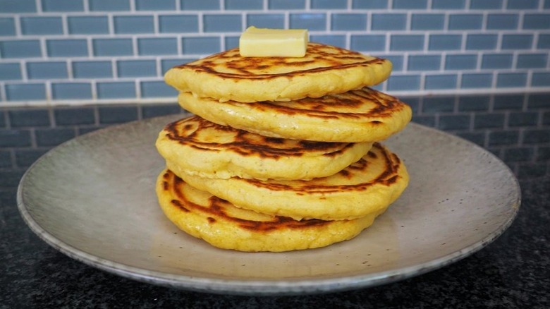 Pancakes stacked on grey plate