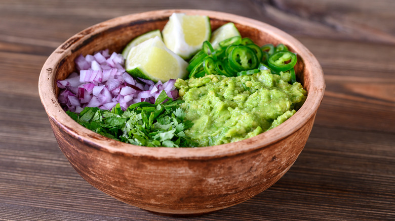 guacamole displayed with ingredients