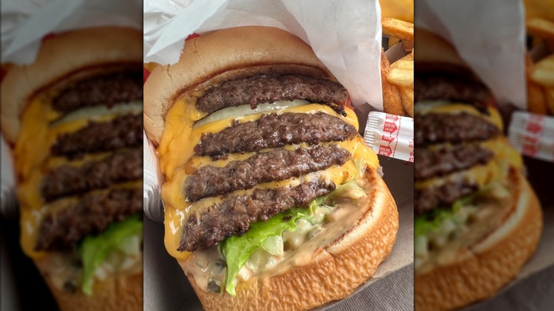 An In-N-Out burger with four patties