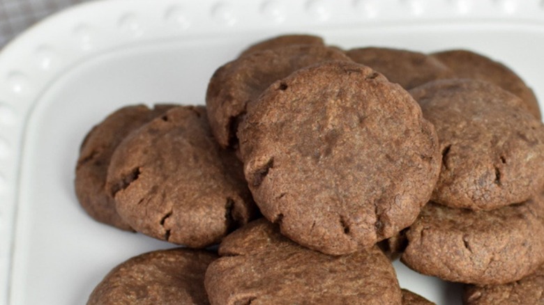Nutella cookies in a stacked pile on square white plate