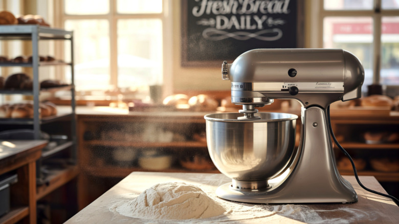 silver KitchenAid mixer on wood counter