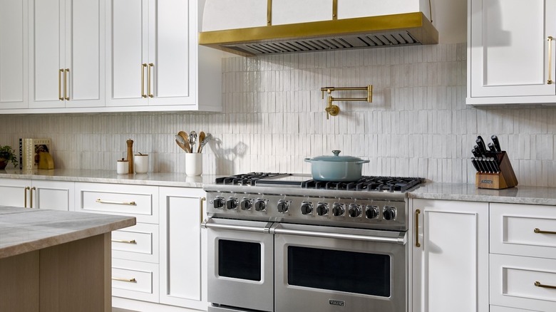 stainless teel Viking range inside of modern white kitchen