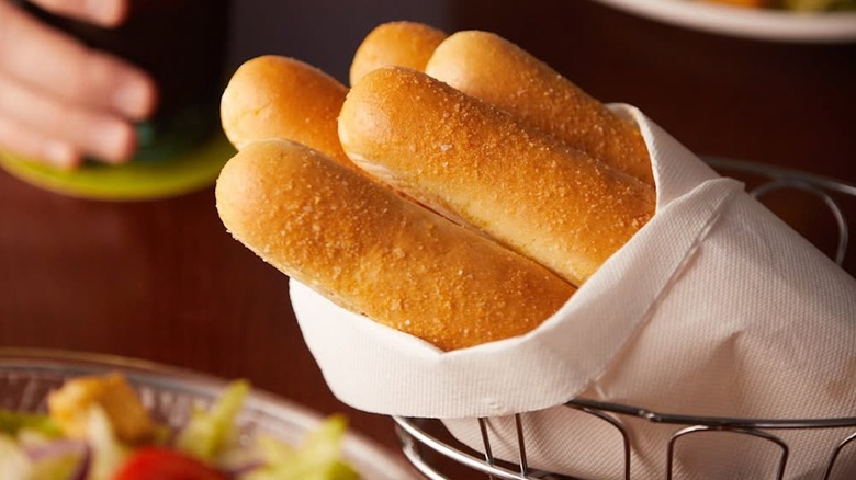 close up of Olive Garden breadsticks in basket