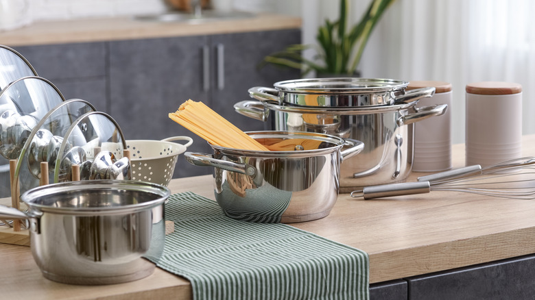 pots and pans sitting on an island