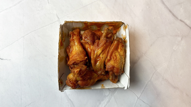Buffalo Wild Wings chicken wings in a takeout cardboard box