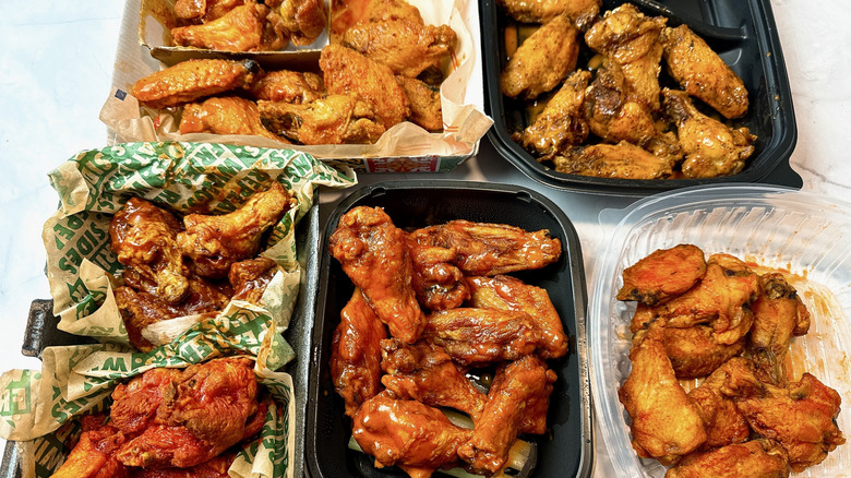 restaurant chicken wings in six takeout containers
