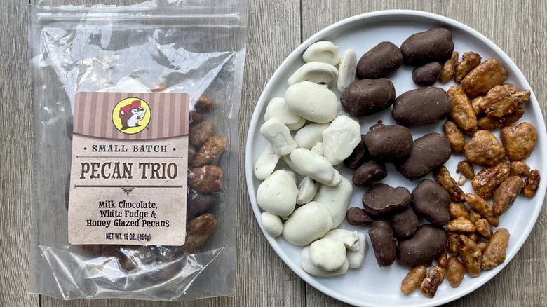 A bag and plate of Buc-ee's Small Batch Pecan Trio