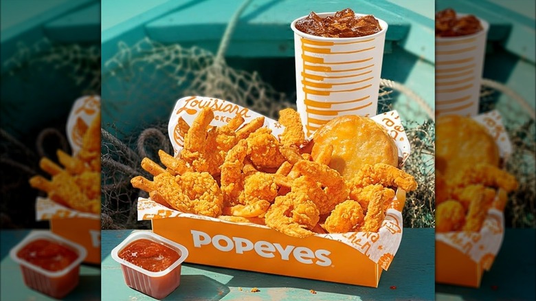 Popeyes Shrimp Tackle Box with fried shrimp, biscuit, cup of dipping sauce and cup of soda