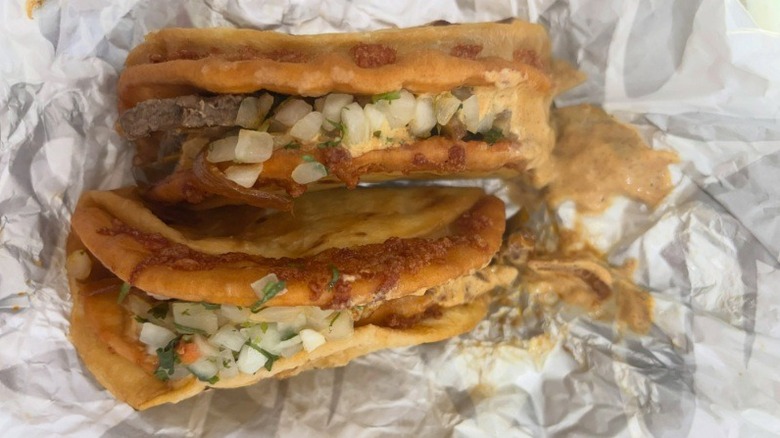 A Steak Fajita Street Chalupa in a wrinkled wrapper