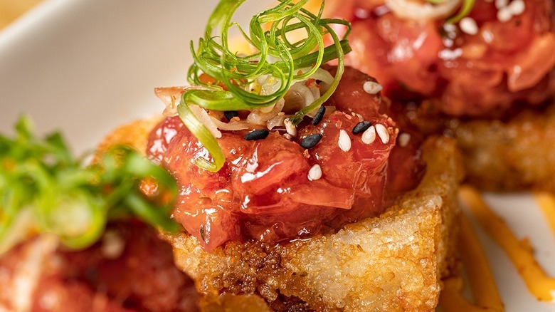 Spicy Tuna appetizer with crispy rice and green onion from Cheesecake Factory