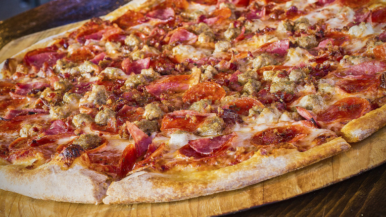 Thin crust meat lovers pizza