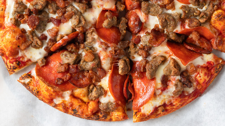 Loaded meat lovers pizza with sausage pepperoni and bacon