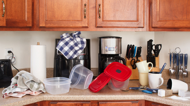 Cluttered kitchen items on counter